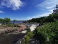 Waterfall Blue sky clouds streaming water Royalty Free Stock Photo