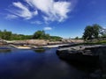 Waterfall Blue sky clouds streaming water Royalty Free Stock Photo