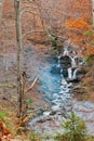 Waterfall Borzhava with smoke from fire under the mountain villa Royalty Free Stock Photo