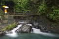 Waterfall and bridge at Gitgit waterfall. Royalty Free Stock Photo