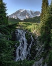 Waterfall and Bridge in Summer Below Mount Rainier Royalty Free Stock Photo