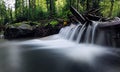 Waterfall at the carpatian mountains green forest