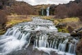 Waterfall cascade in the area of Gjain in Porsdalur in the Icelandic highlands. Overcast sky. Long exposure shot of the river Royalty Free Stock Photo