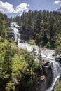 Waterfall cascade in high mountains beside Pont d`Espagne at Marcadau valley, Pyrenees National Park, France