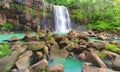 Waterfall Cascade On The Rock Cliff Flow Down The River Stream At The Edge of Tropical Rainforest.