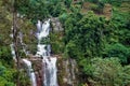 The waterfall cascades down from the rocks. Royalty Free Stock Photo