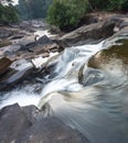 Waterfall cascades,over jagged rocks and boulders at Maak Ngaew falls,near Pakse,Southern Laos