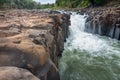 Waterfall cascades,over jagged rocks and boulders at Maak Ngaew falls,near Pakse,Southern Laos