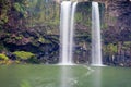 Waterfall cascading over cliff into peaceful pool Royalty Free Stock Photo