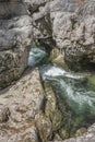 Waterfall cascading over rocks in blue pond Royalty Free Stock Photo