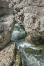 Waterfall cascading over rocks in blue pond Royalty Free Stock Photo