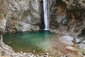 Waterfall Cascata Del Palvico with green lake Royalty Free Stock Photo