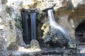 Waterfall cave on lake of majolan at Blanquefort city in France Royalty Free Stock Photo