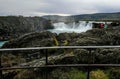 Waterfall cliffs hills weather cold tourist Iceland Royalty Free Stock Photo