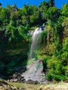 Waterfall coming down from a hill forest