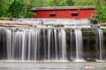 Waterfall and Covered Bridge Royalty Free Stock Photo