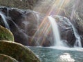 Waterfall with the diffuse light in rainbow colors