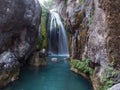 Waterfall on emerald river