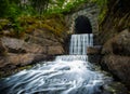 Waterfall at the end of a tunnel Royalty Free Stock Photo