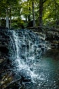 Waterfall falling down from a rock cascade.