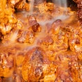 Waterfall falling on the orange and gold rocks