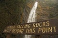 Waterfall with falling rocks sign