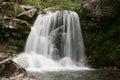 Waterfall flowing in a hidden place in a green peaceful place