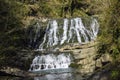 Waterfall flowing in jungle wilderness