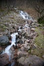 A waterfall flowing into Lake Buttermere, Cumbria in the UK Royalty Free Stock Photo