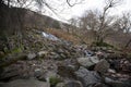 A waterfall flowing into Lake Buttermere, Cumbria in the UK Royalty Free Stock Photo