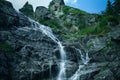 Waterfall flowing over huge rocks Royalty Free Stock Photo