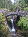 Waterfall under a stone bridge Royalty Free Stock Photo