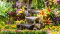 Waterfall flows in cozy home flower garden Royalty Free Stock Photo