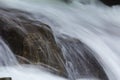 Waterfall flows down the long line of cliffs