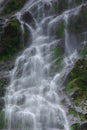 Waterfall flows down the long line of cliffs