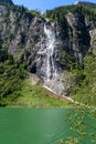 Waterfall flows over granite roocks in the mountains, Stillup Lake, Austria, Tyrol