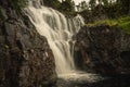 Waterfall flushing down a mountainside in northern Sweden Royalty Free Stock Photo