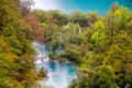 Waterfall in forest. Crystal clear water. wooden walk path, Plitvice lakes, Croatia Royalty Free Stock Photo
