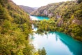 Waterfall in forest. Crystal clear water. wooden walk path, Plitvice lakes, Croatia Royalty Free Stock Photo