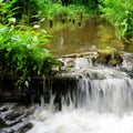 Waterfall in forest river. Royalty Free Stock Photo