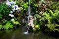 Waterfall and fountain in tropical garden in Madeira Royalty Free Stock Photo