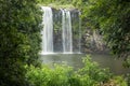 A waterfall framed by greenery as the water drops into the plunge pool below Royalty Free Stock Photo