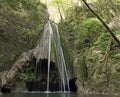 waterfall with fresh water in the middle of the woods with Royalty Free Stock Photo