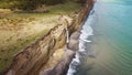 Waterfall on Golovinsky Cliff on Kunashir Island, Kuril Islands, Russia. Aerial photography Royalty Free Stock Photo