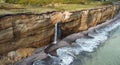 Waterfall on Golovinsky Cliff on Kunashir Island, Kuril Islands, Russia. Aerial view Royalty Free Stock Photo