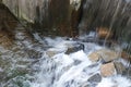 Waterfall on the gray stones full of blurred splashes