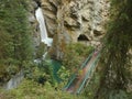 Waterfall on a green creek Royalty Free Stock Photo