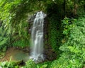 Waterfall in the green hills of Aye River Royalty Free Stock Photo