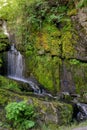 Waterfall And Green Mossy Rocks