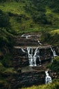 Waterfall among the green mountains. Waterfalls Of Sri Lanka. Landscapes Of Asia. Aerial photography. Tea plantation. Green hill.